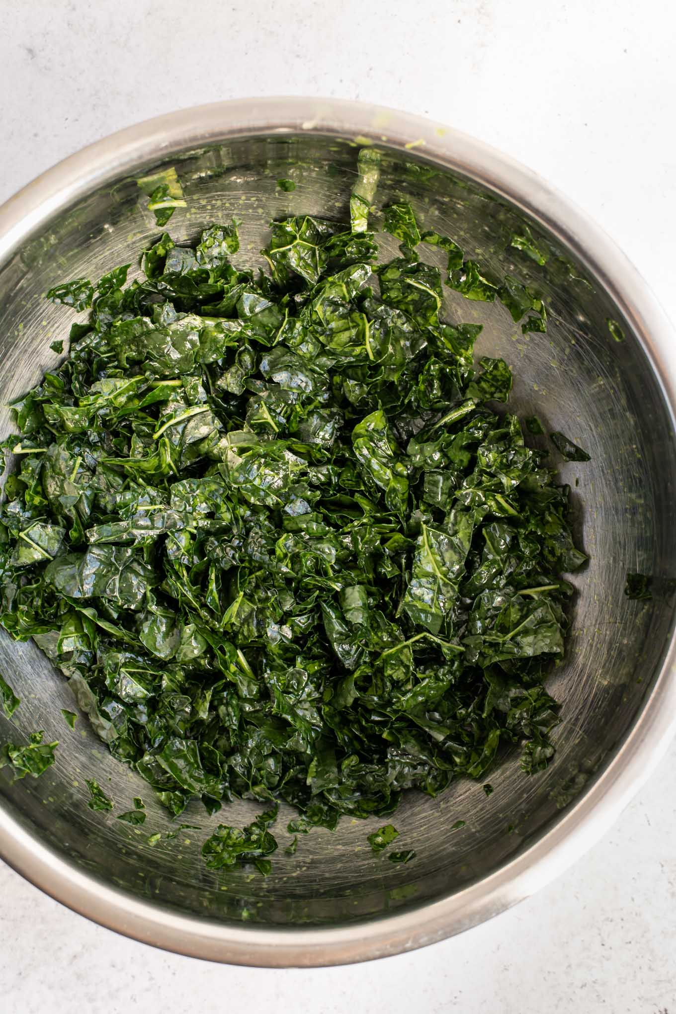 massaged kale in mixing bowl