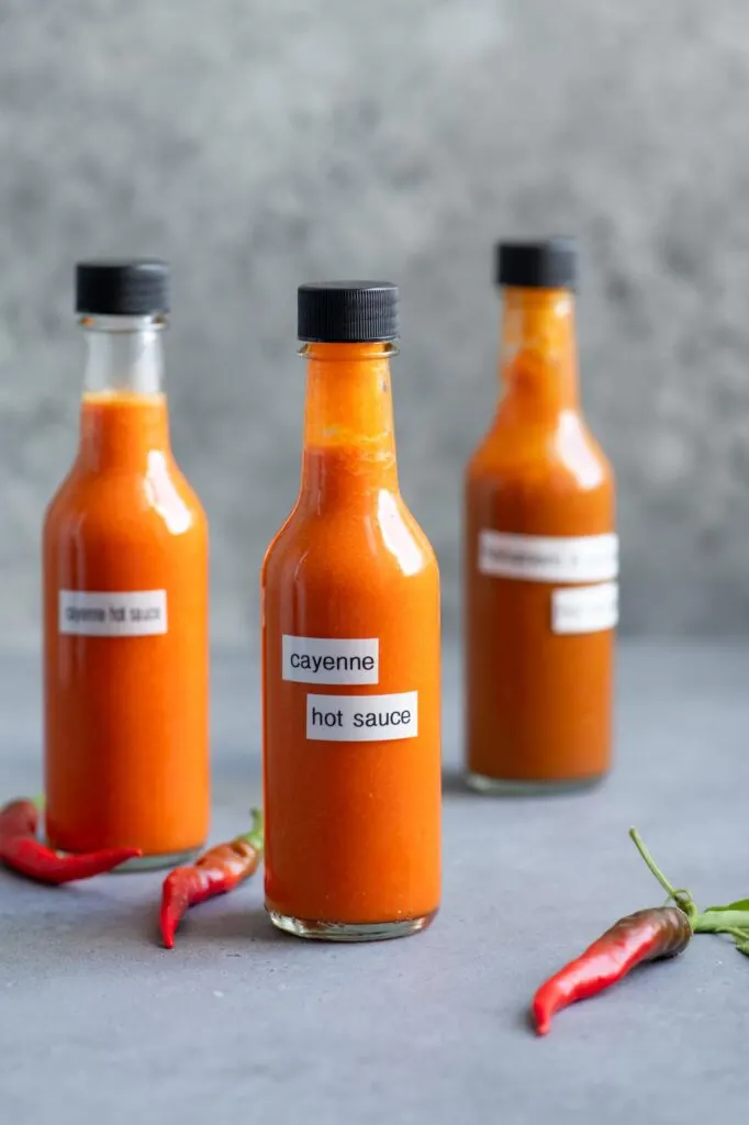 three bottles of homemade hot sauce