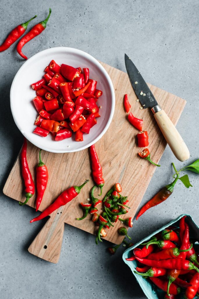 cutting stems and cutting cayenne peers into pieces