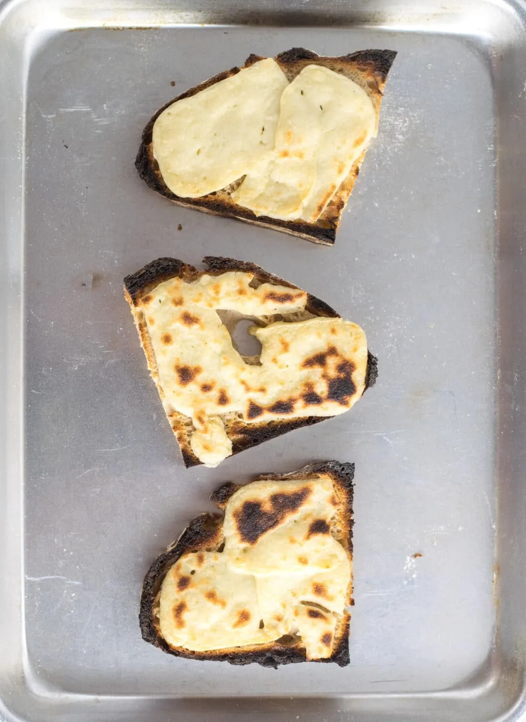 cheese broiled on bread to melt
