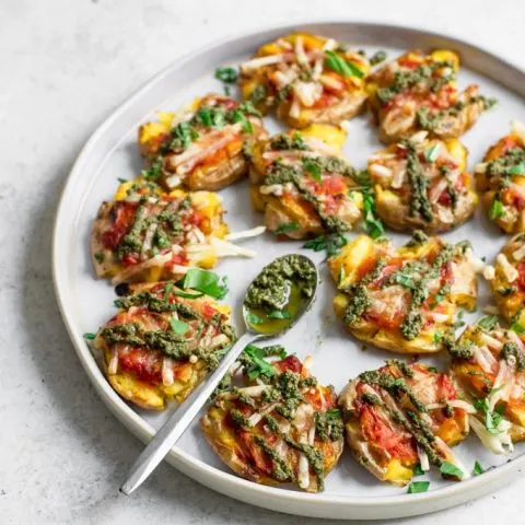 pesto smashed potato pizzas served on a plate