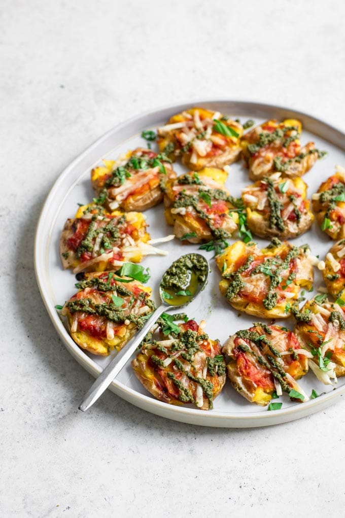 pesto smashed potato pizzas served on a plate