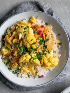 tandoori cauliflower and seitan with a garnish of cilantro served over basmati rice