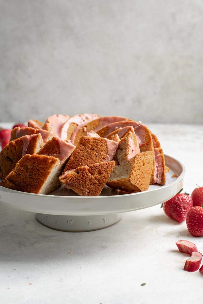 three slices of the almond rhubard bundt cake cut and laying at an angle cake
