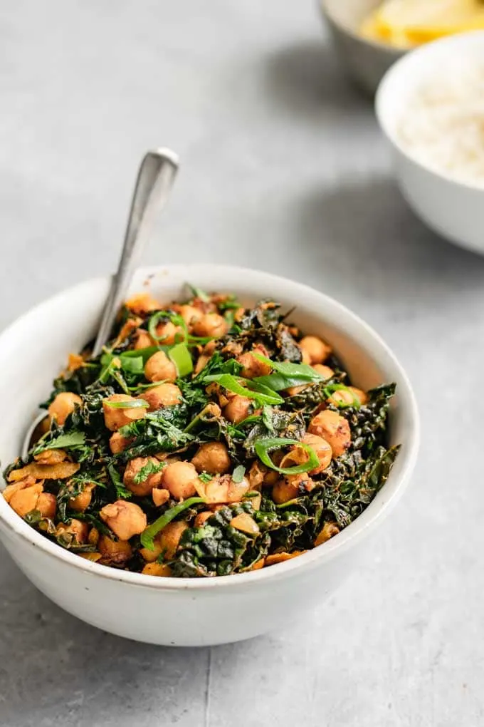 A bowl of Indian curried chickpeas and greens