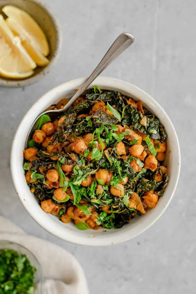 Indian chickpeas and greens served with extra lemon wedges