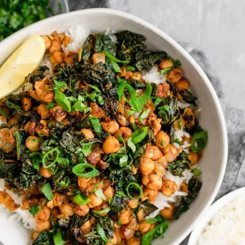 Indian spiced chickpeas and greens, garnished with cilantro and scallions