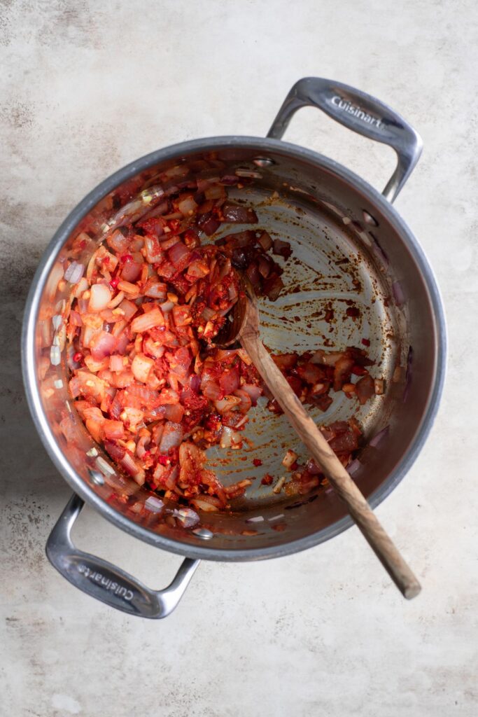 aromatics and curry paste sautéed in pot