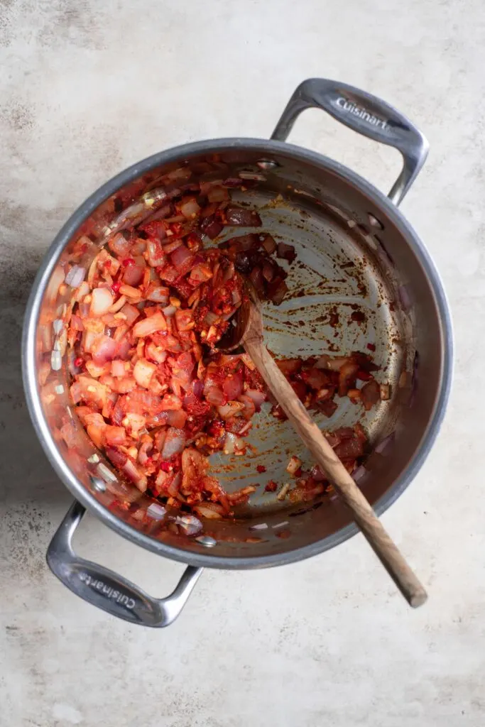 aromatics and curry paste sautéed in pot