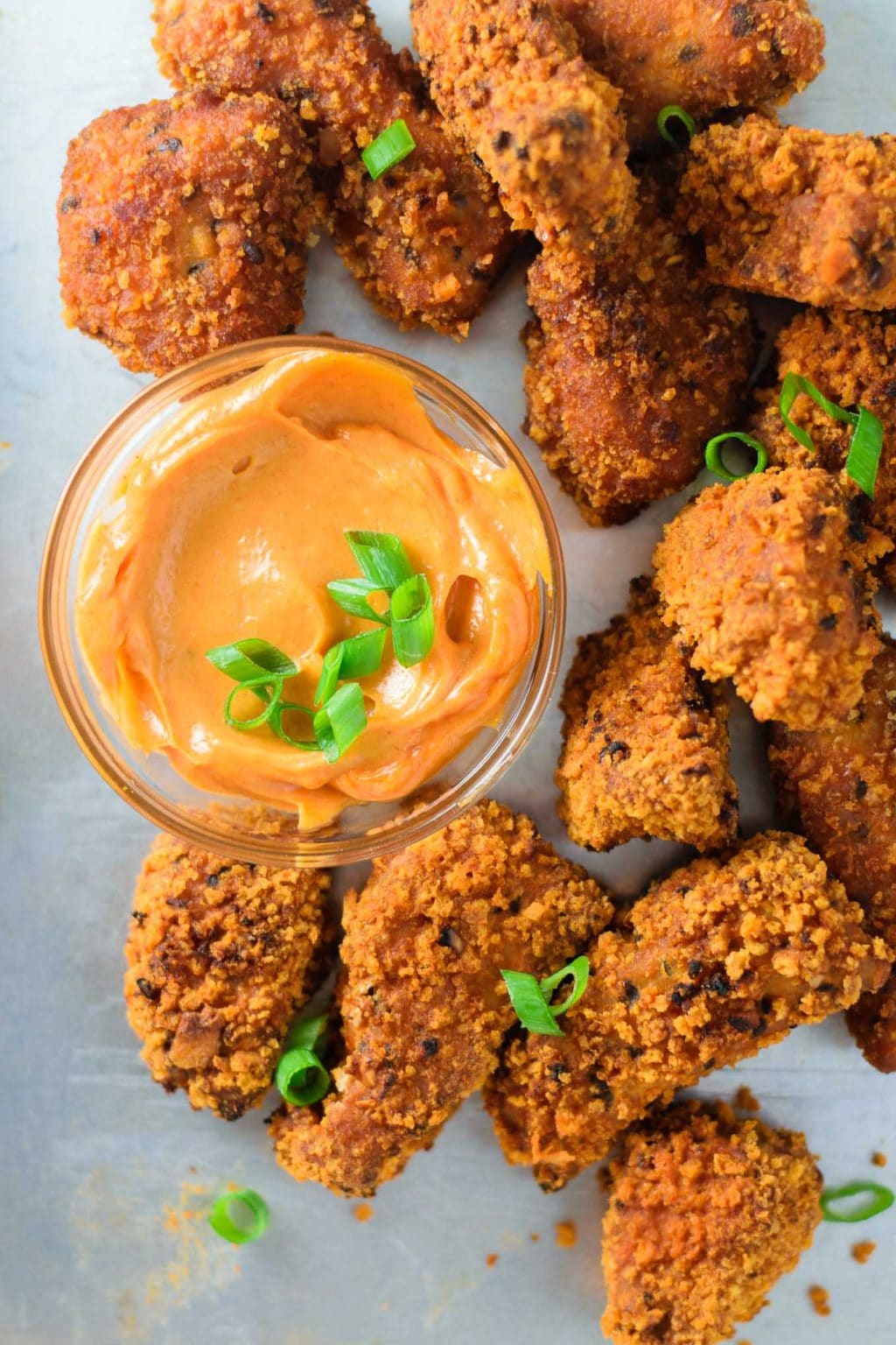 close of of gochujang tempeh wings with gochujang mayo dip