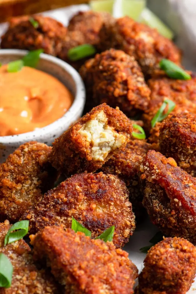 close up of gochujang wings showing texture of tempeh and breading