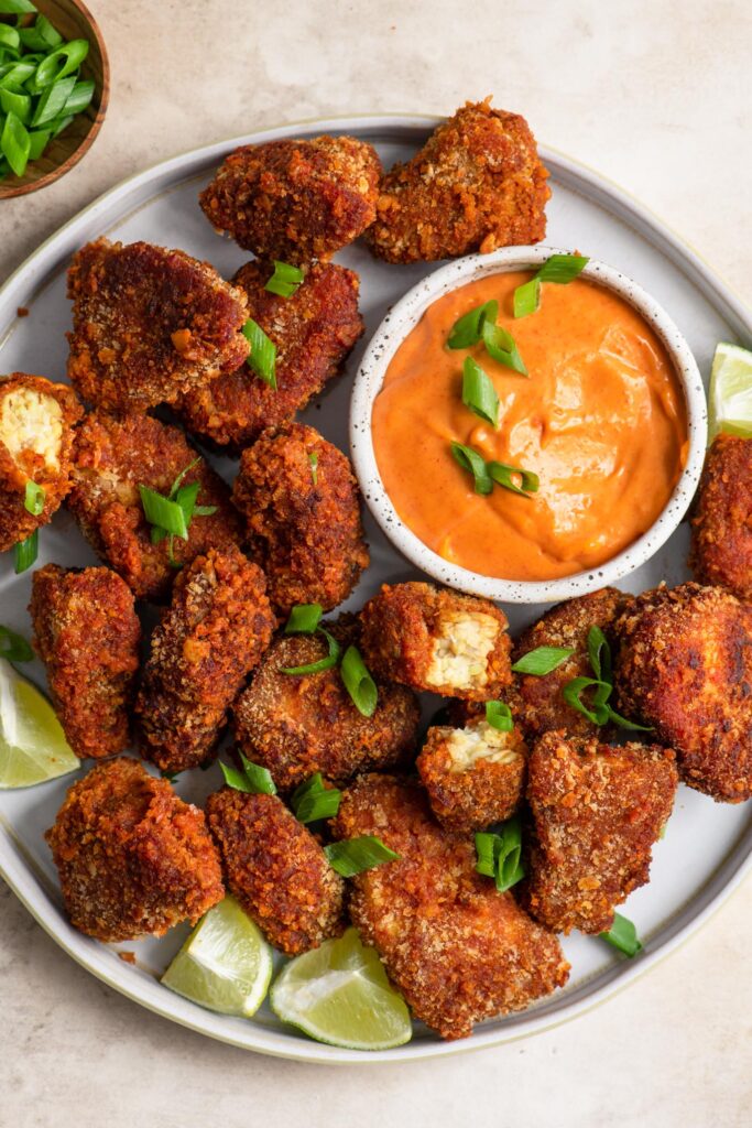 gochujang tempeh wings garnished with green onions