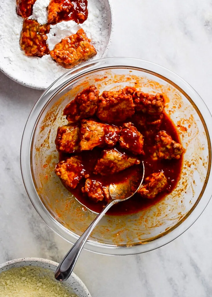 breading the tempeh wings in cornstarch and panko breadcrumbs