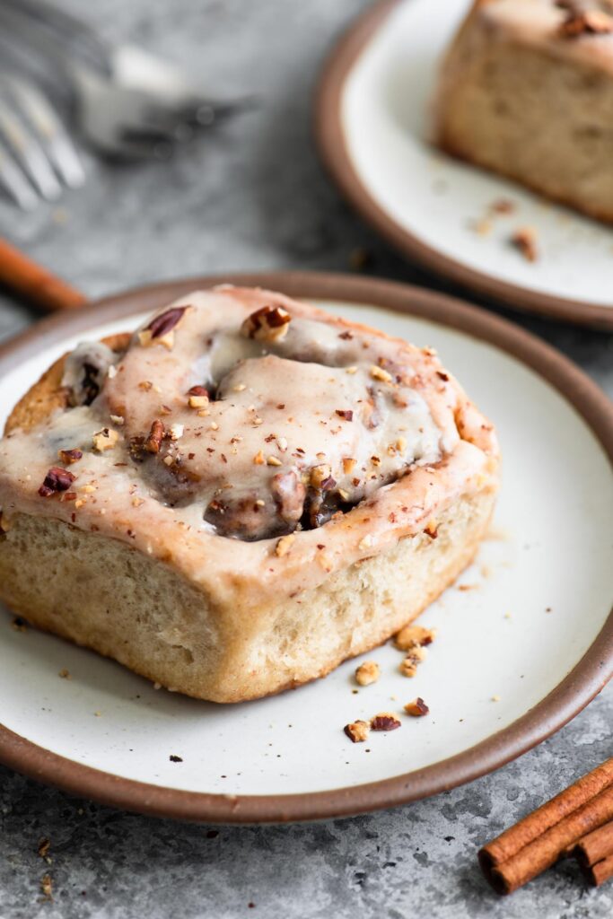 apple pecan cinnamon roll on a plate