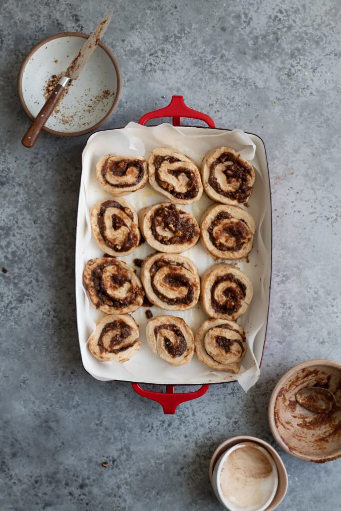 shaped buns in baking pan before rising