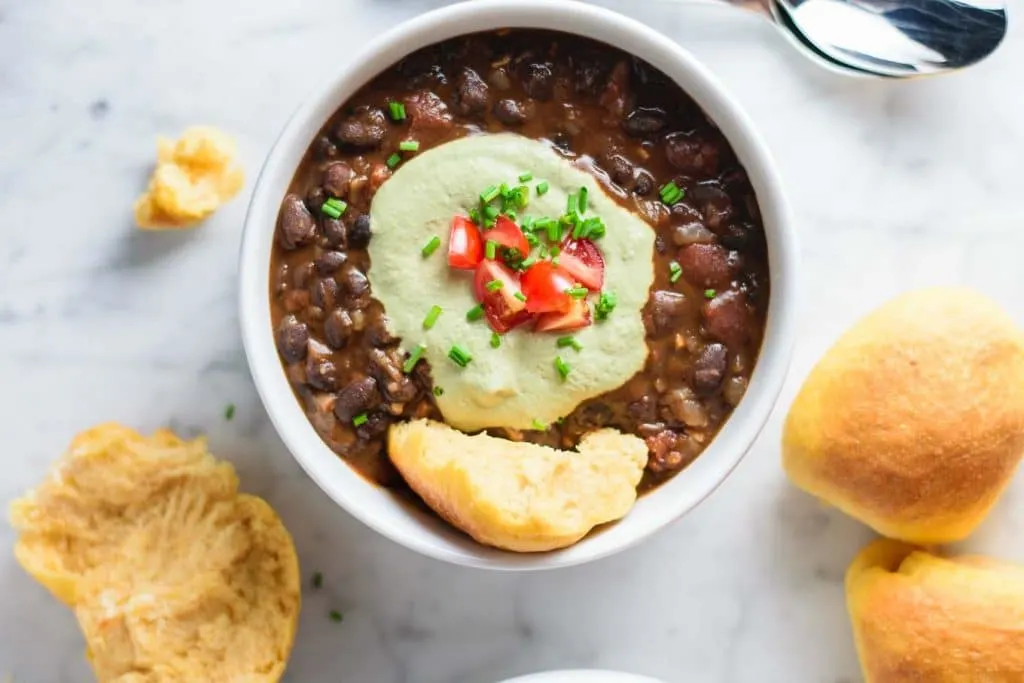 black bean soup with pepita cream and sweet potato rolls
