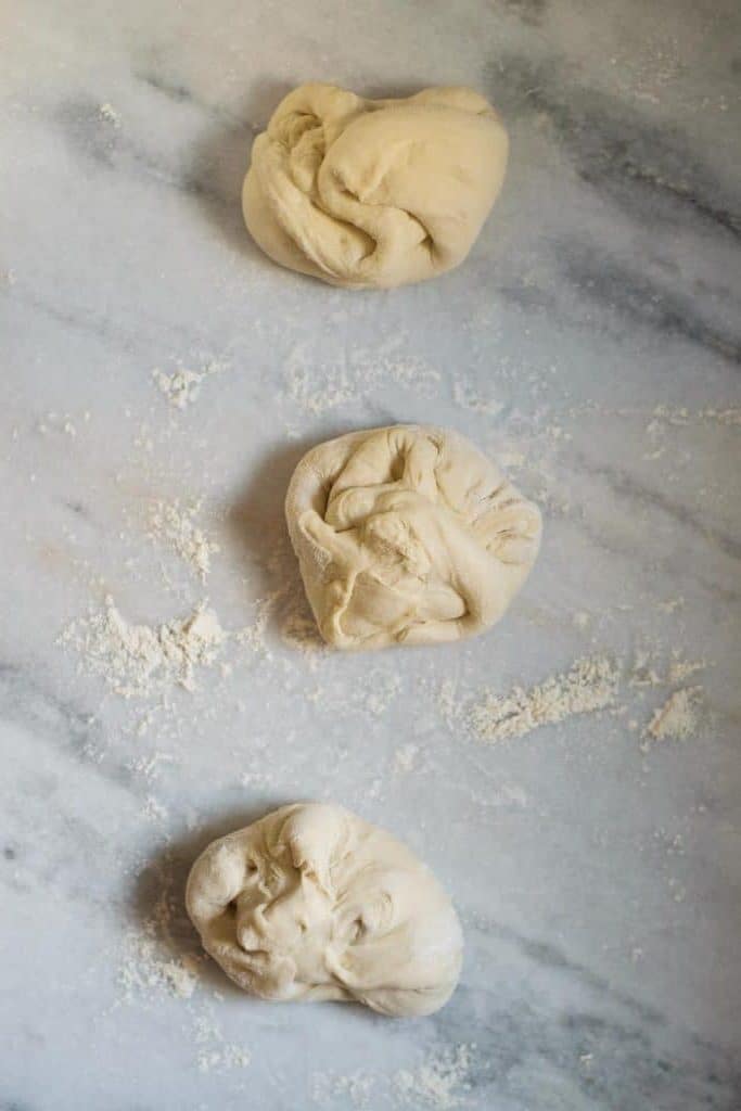 shaping the pizza dough into dough balls