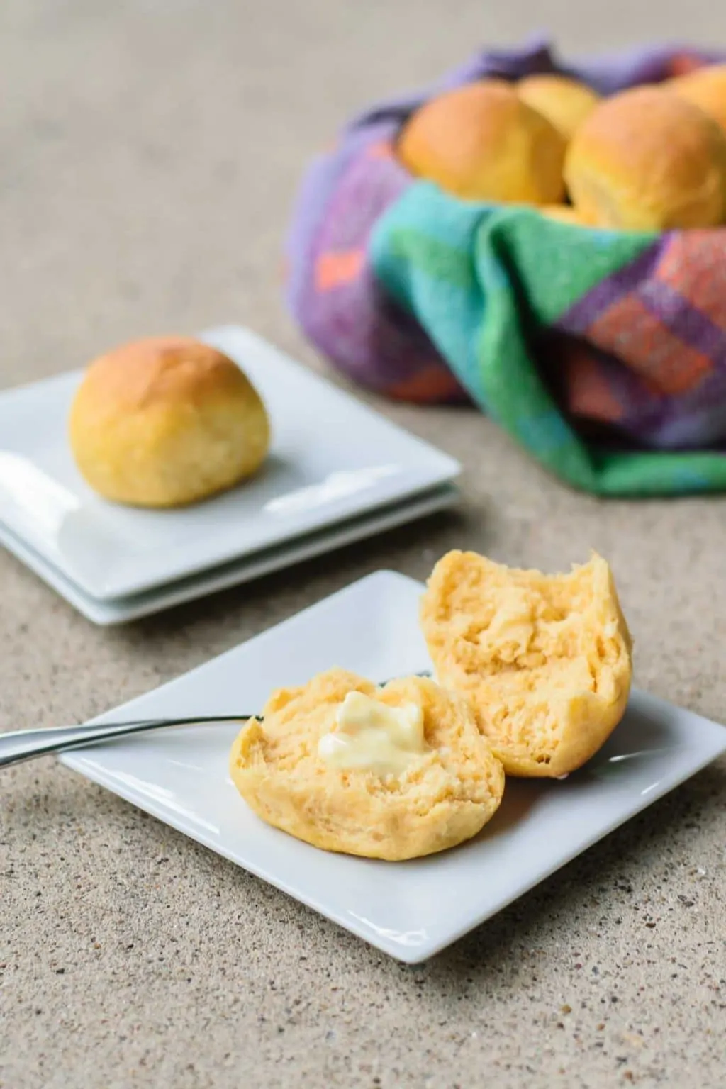 vegan sweet potato rolls served on plate with basket in background