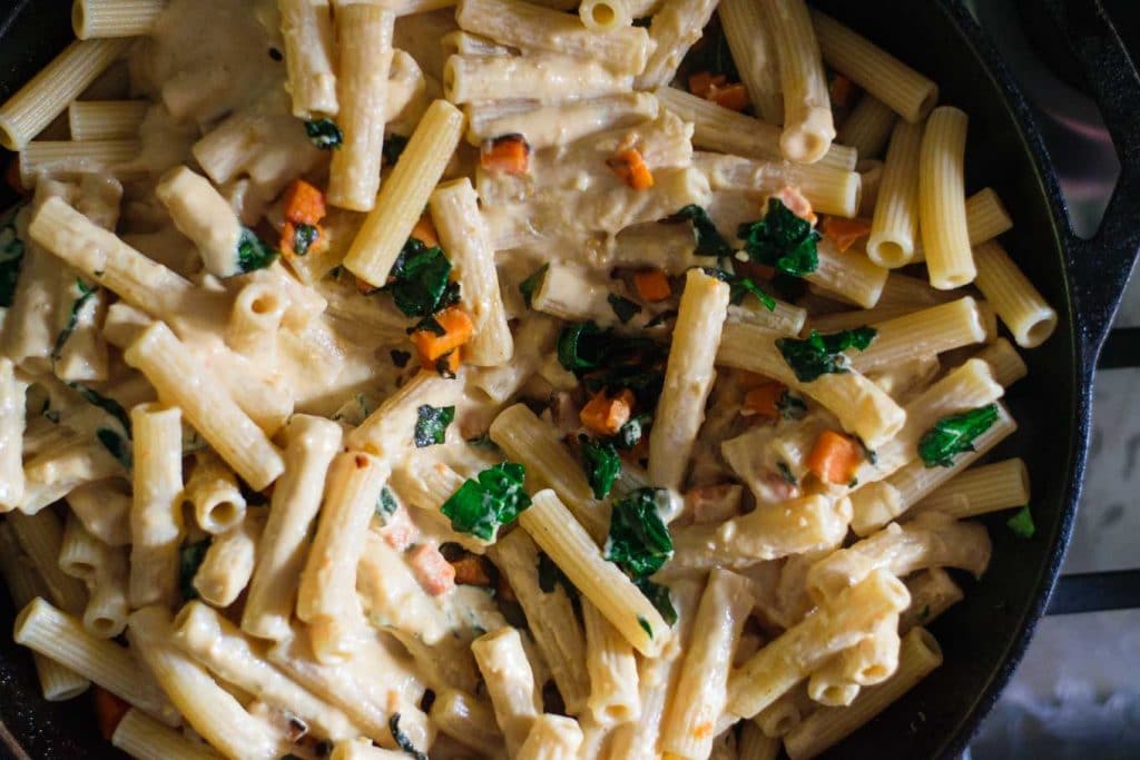 sweet potatoes, kale, and pasta with tahini sauce