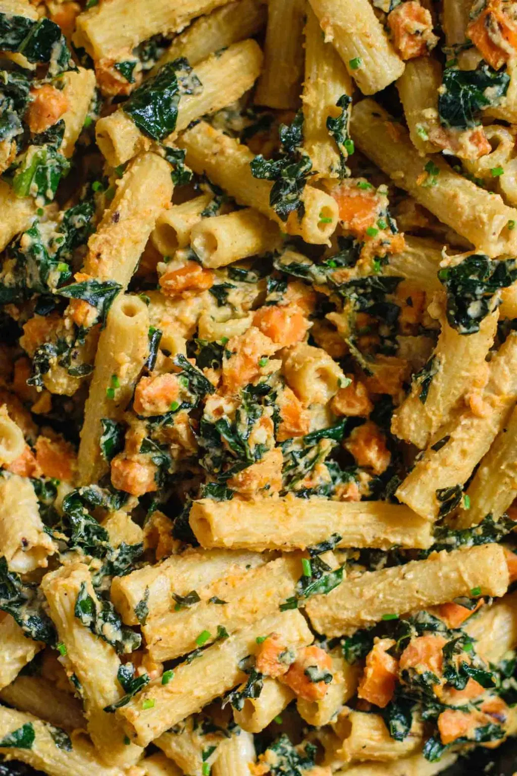 vegan tahini pasta skillet with sweet potato and kale closeup