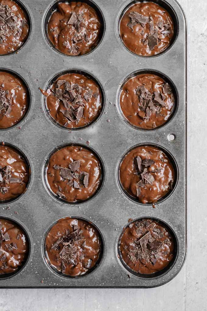 double chocolate banana muffins in muffin tin before baking