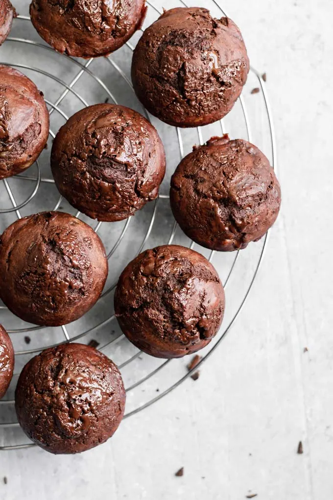 Vegan double chocolate banana muffins on cooling rack