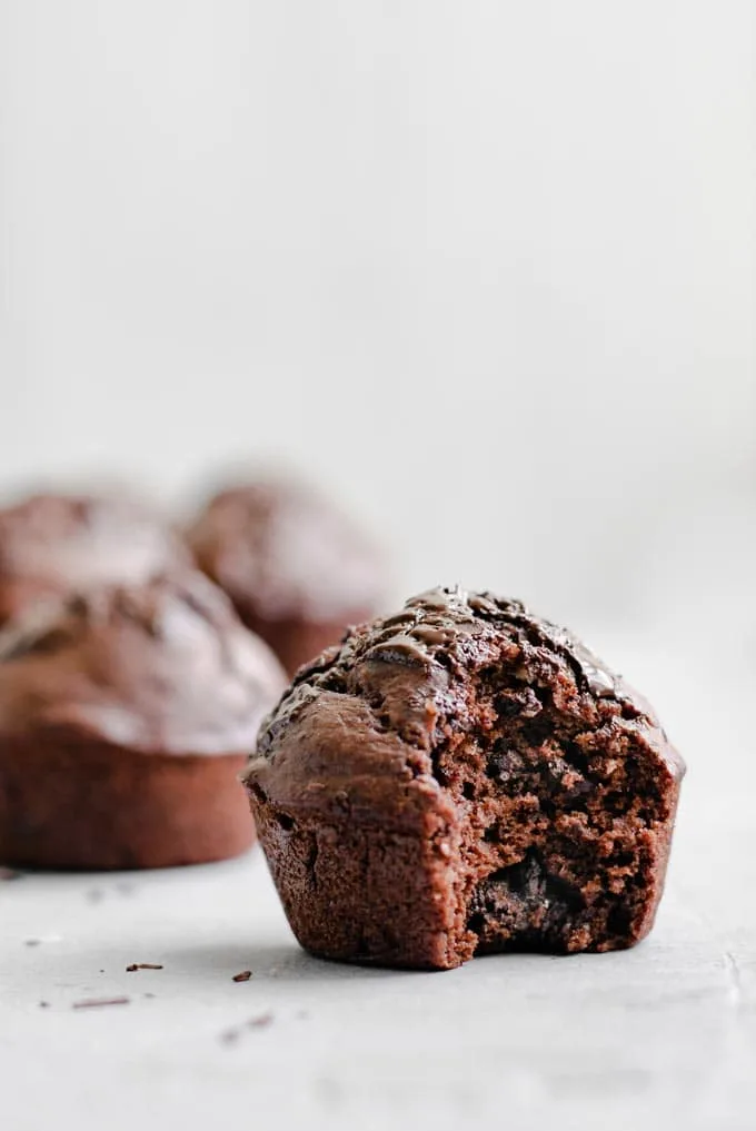 bite shot of a vegan double chocolate banana muffin