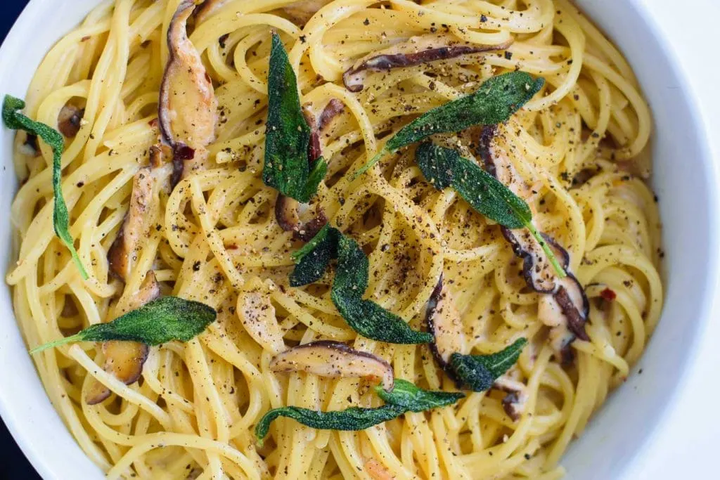 vegan spaghetti ai funghi with crispy sage (spaghetti and mushrooms in vegan cream sauce)