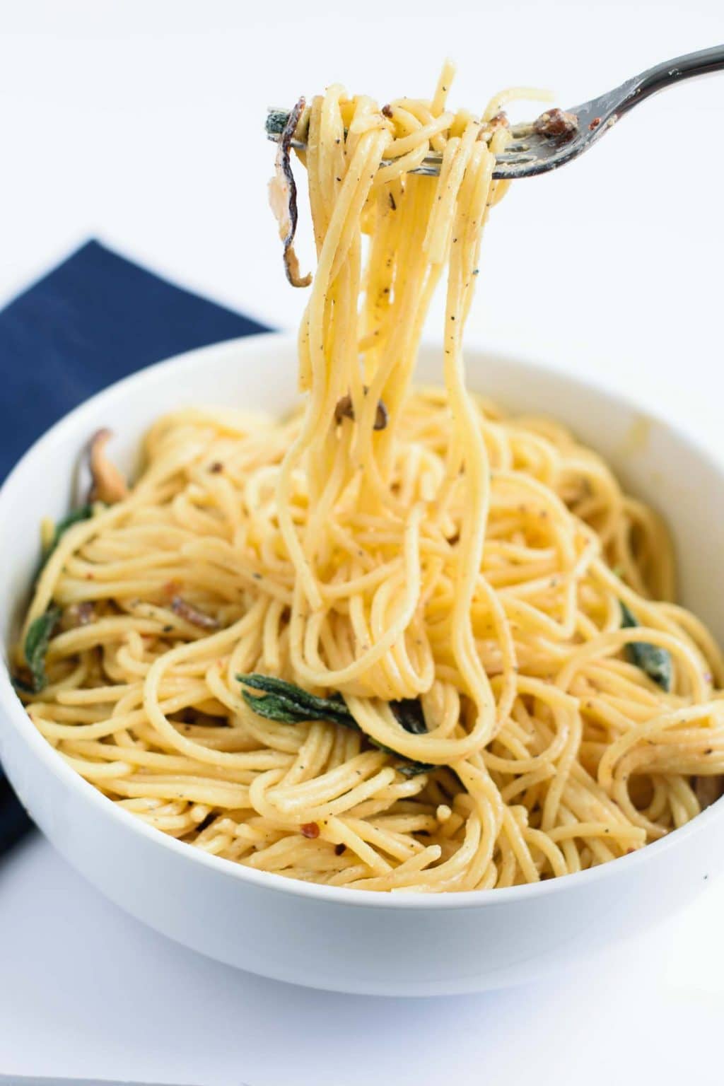 vegan spaghetti ai funghi with crispy sage (spaghetti and mushrooms in vegan cream sauce)
