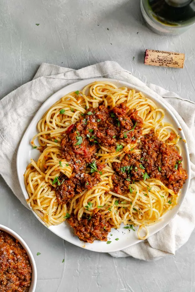 vegan black lentil bolognese with spaghetti and red wine