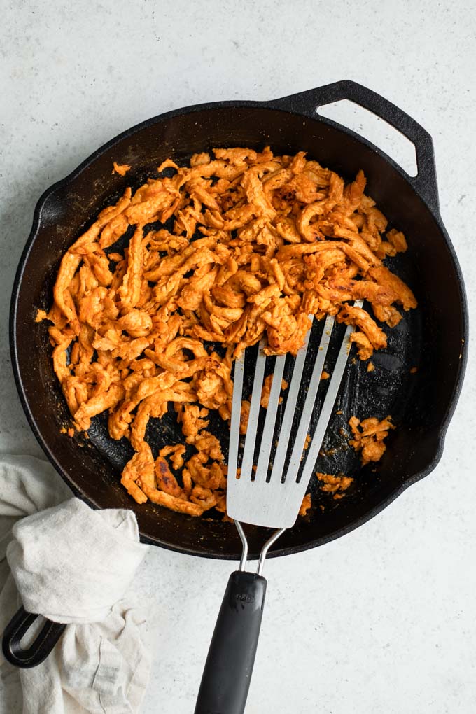 buffalo soy curls in cast iron skillet