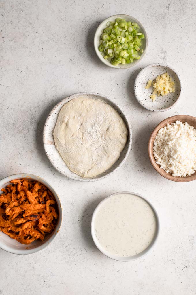 pizza dough and toppings for vegan buffalo pizza