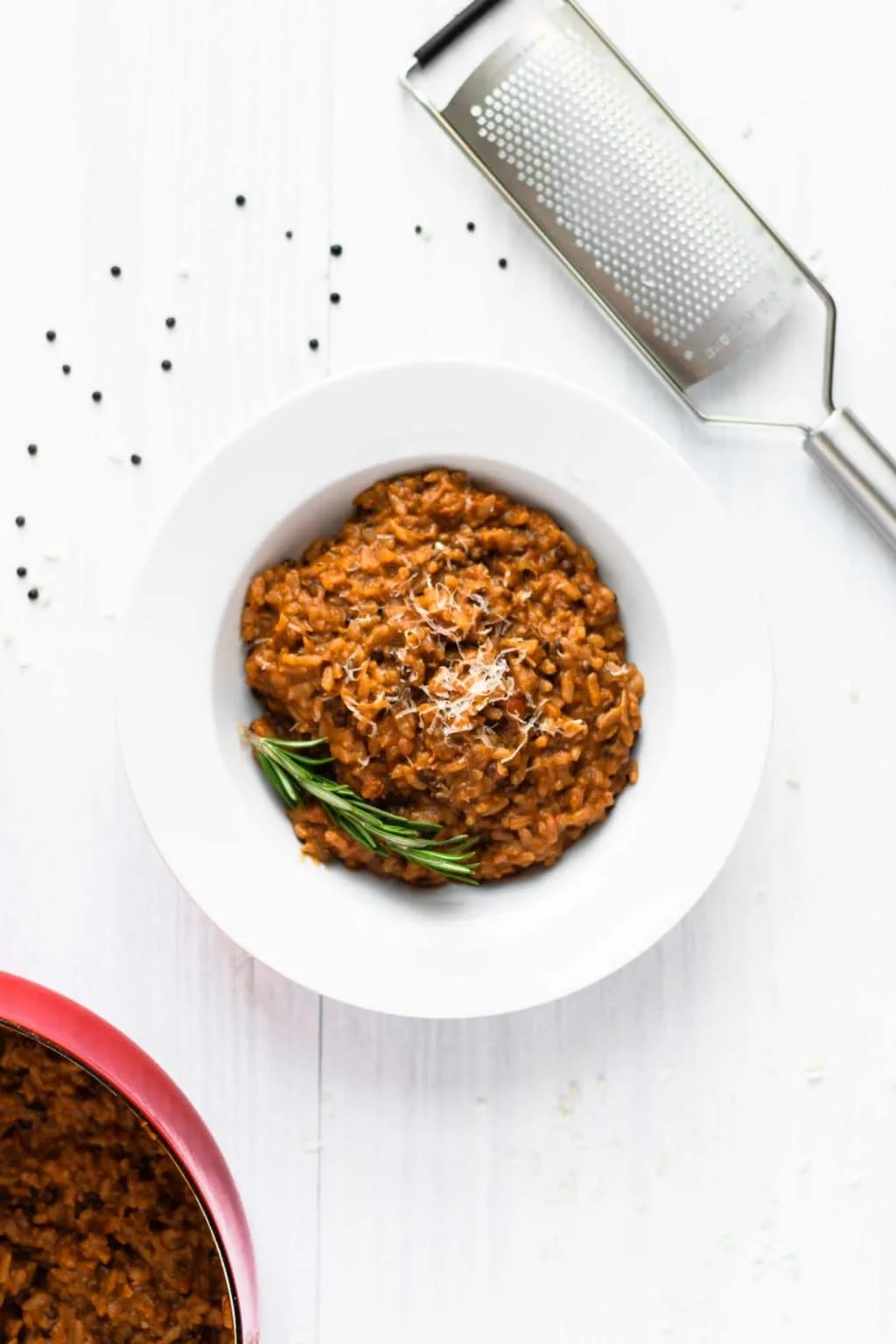 vegan risotto bolognese served with vegan parmesan