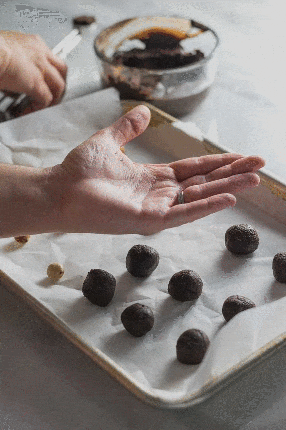 Shaping a hazelnut ganache with a hazelnut in the center for a truffle center