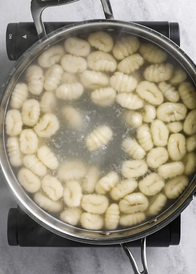 gnocchi cooking in boiling water