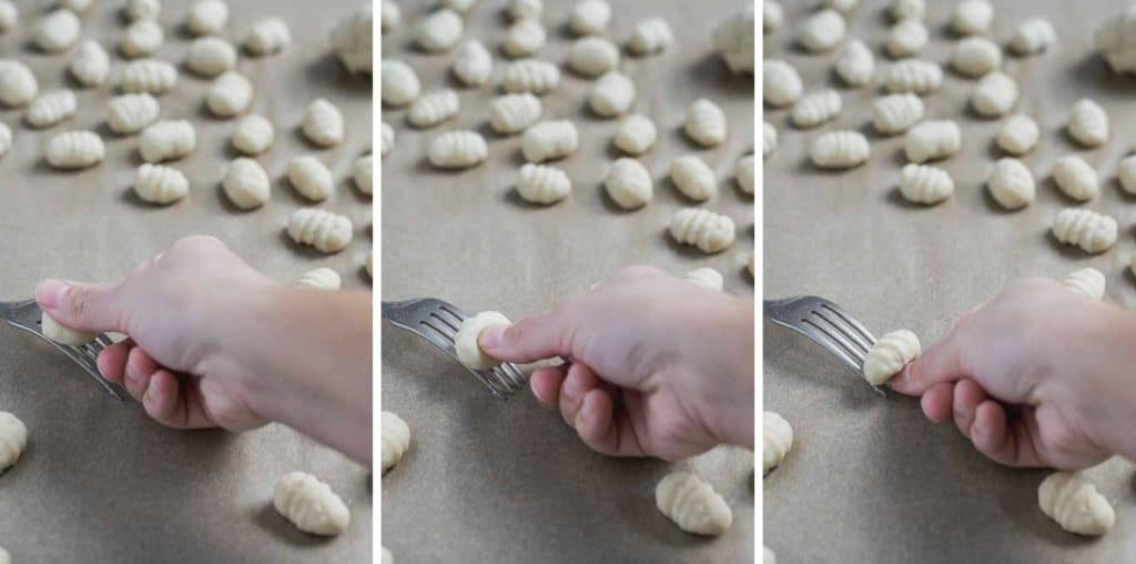 hand shaping shaping gnocchi using the backside of a fork