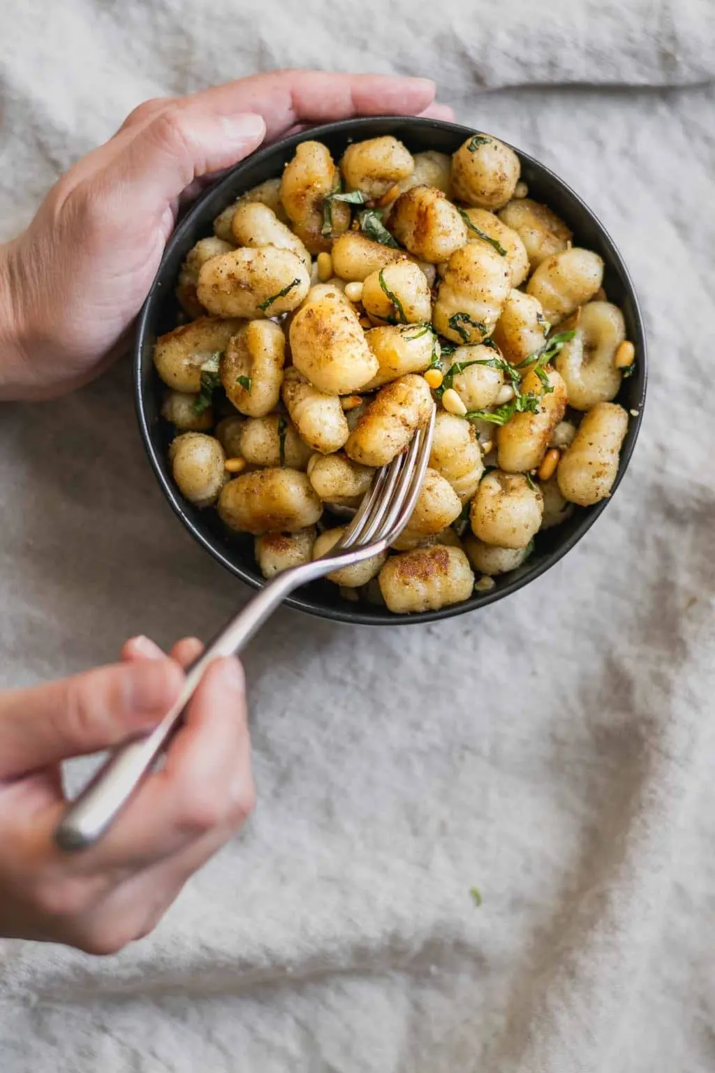 Having a bite of vegan brown butter gnocchi