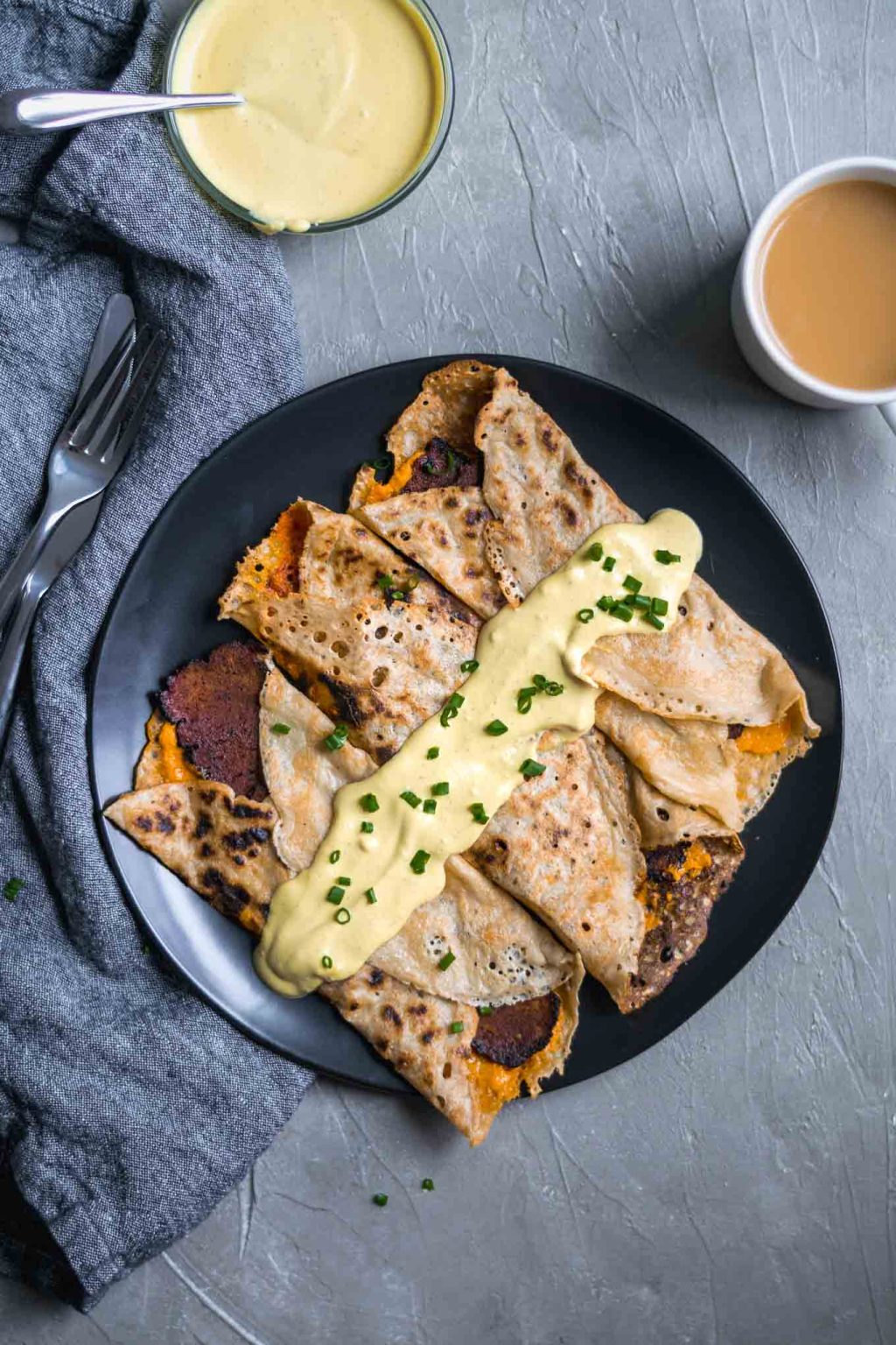 Vegan crepes with cheddar, seitan bacon, and hollandaise. 100% vegan. 