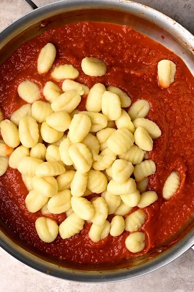 cooked gnocchi added to sauce