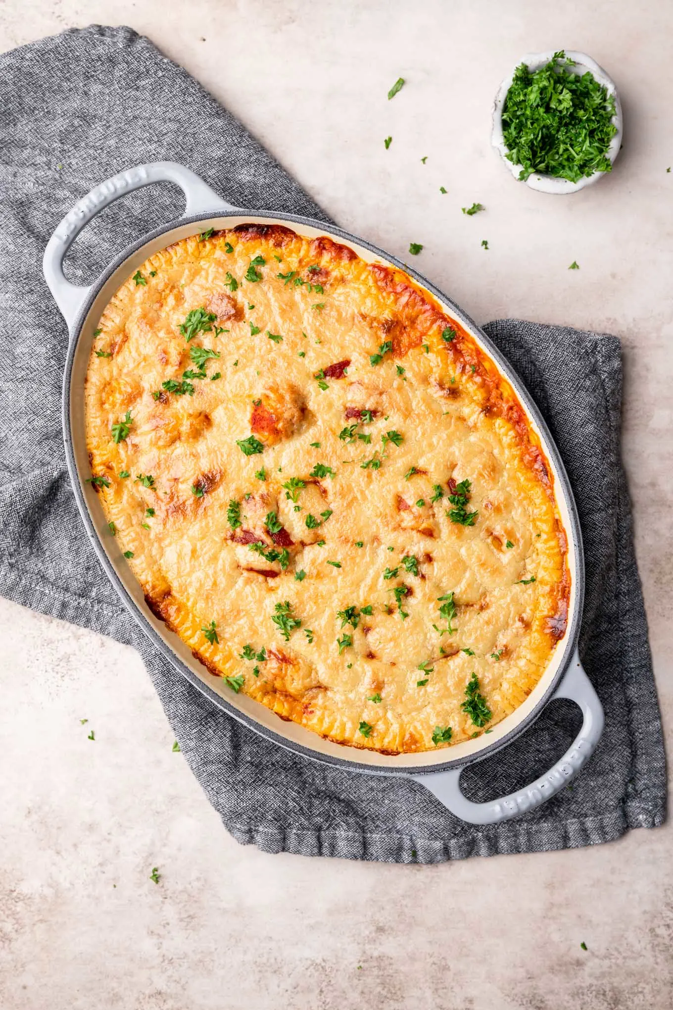 vegan baked gnocchi in an oval casserole dish