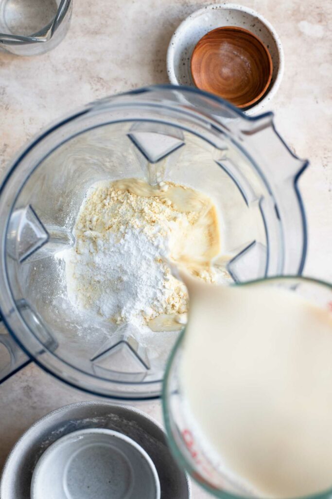 adding all the crepe ingredients to a blender