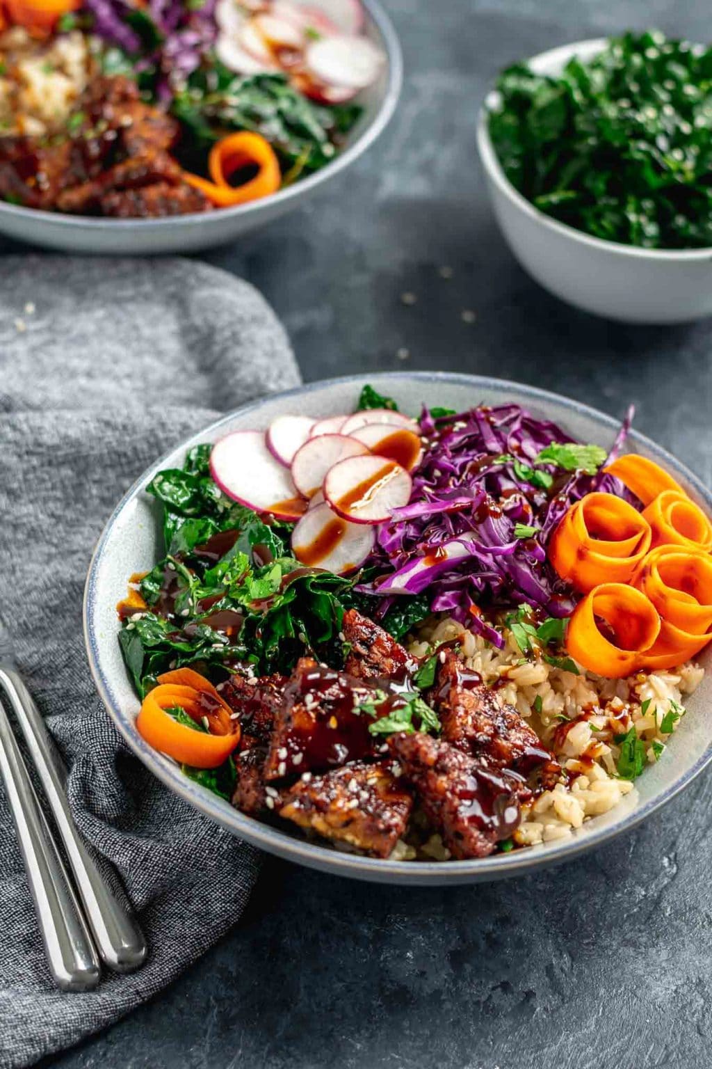 hoisin glazed tempeh bowls with sesame kale and hoisin sauce drizzle