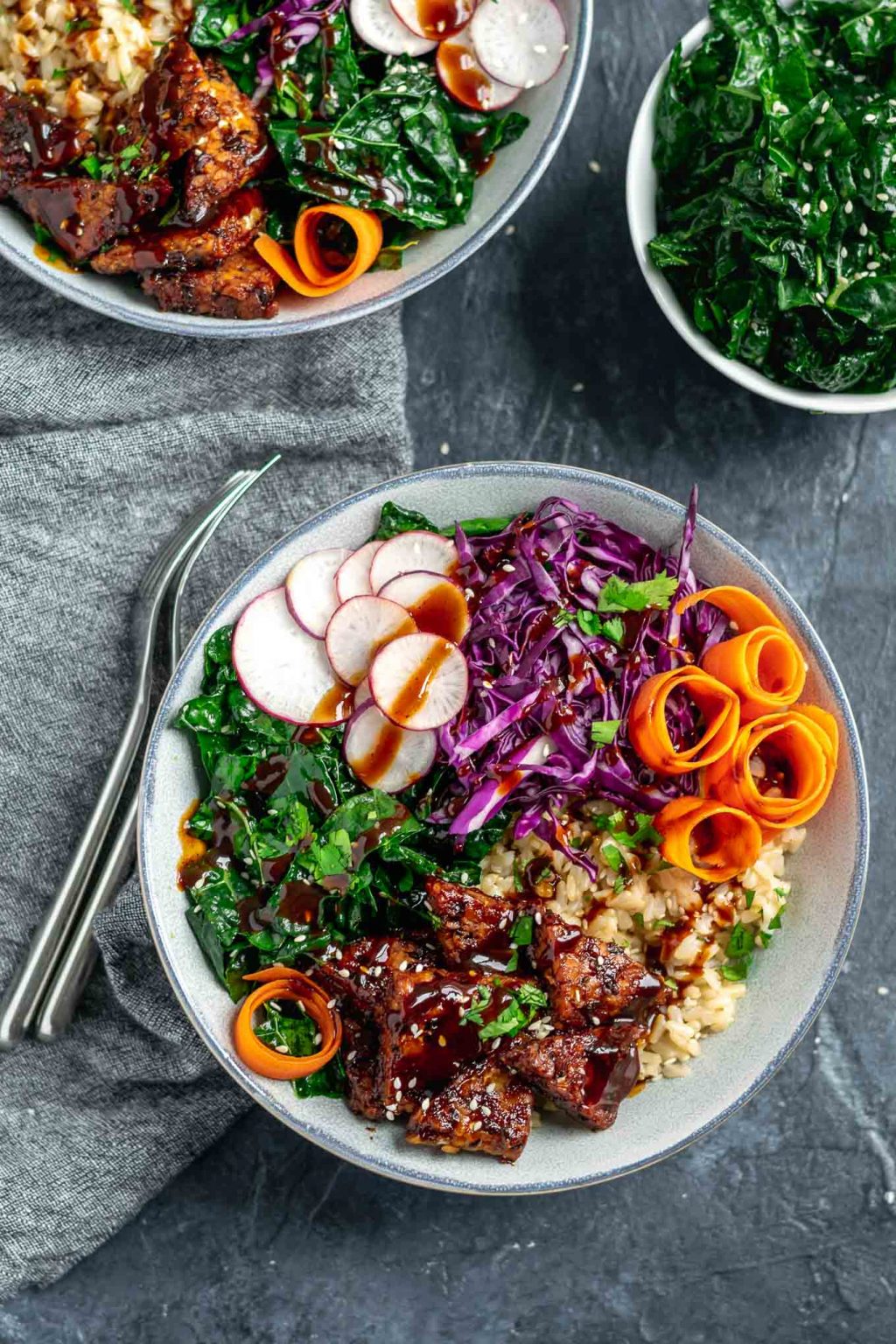 hoisin glazed tempeh bowls with sesame kale and hoisin sauce drizzle