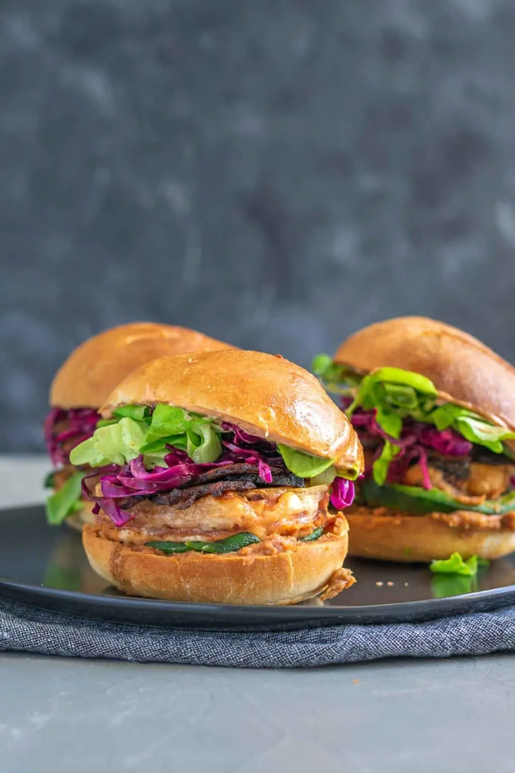 Vegan battered tofu Mexican tortas, 3 on a plate