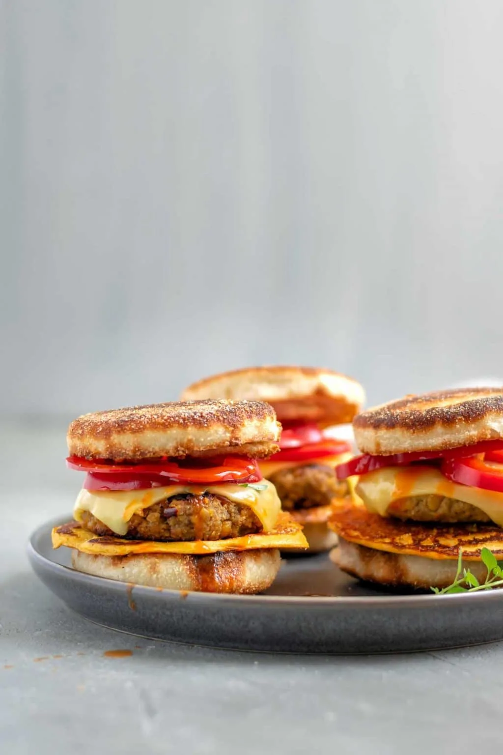 vegan breakfast egg and sausage muffins. 3 on a plate, side view