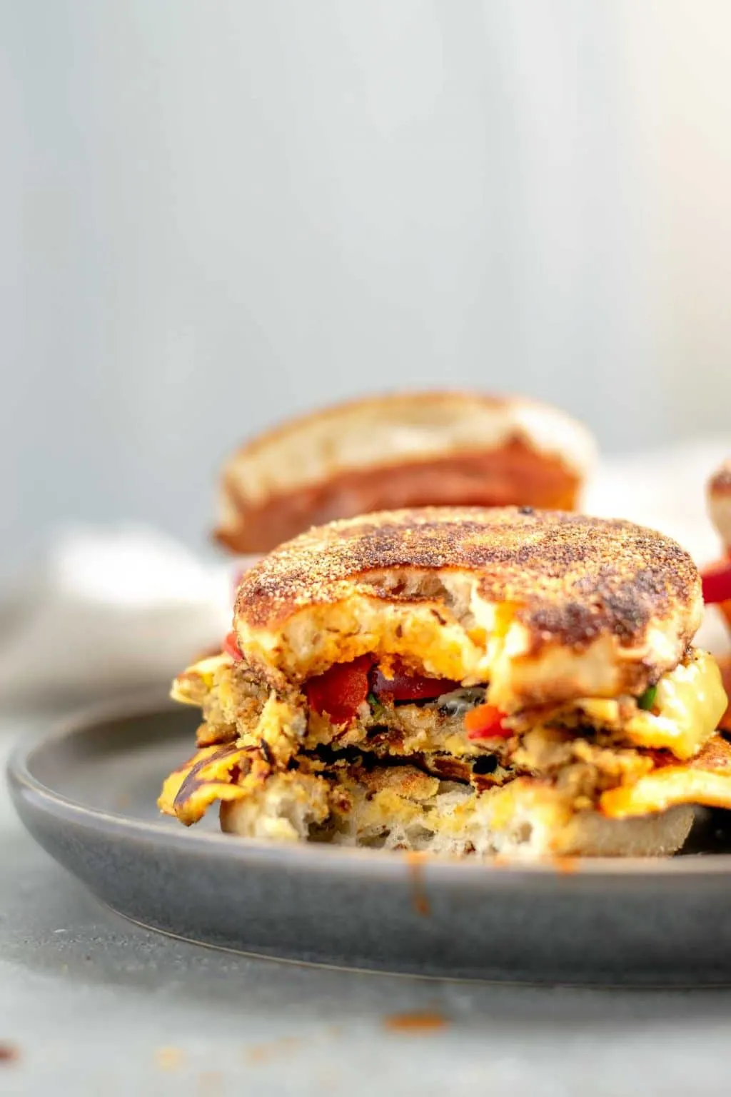 vegan breakfast egg and sausage muffins, side view with a bite taken out