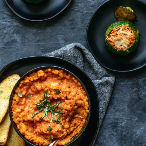 creamy vegan barley risotto stuffed zucchini