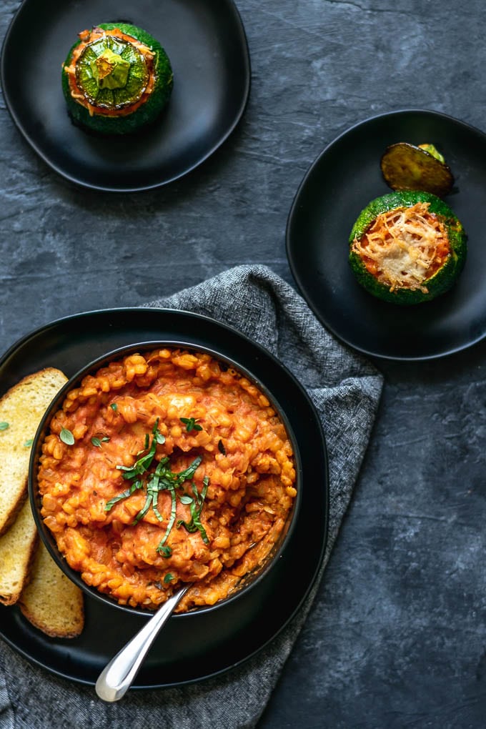 creamy vegan barley risotto stuffed zucchini