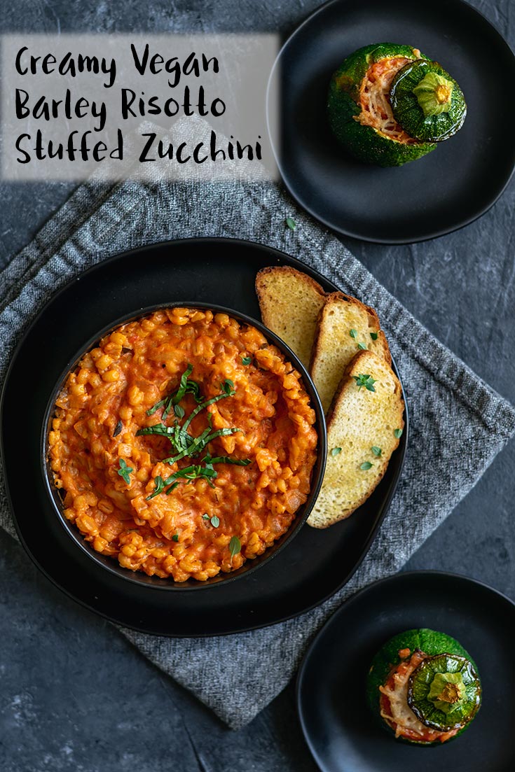 Creamy herbed tomato barley risotto with zucchini is stuffed into the hollowed out summer squash and baked for a super cute presentation. The chewy, rich tasting barley pairs perfectly with the tender and juicy squash for a delicious vegan meal. | thecuriouschickpea.com #vegan #zucchini #barley #risotto