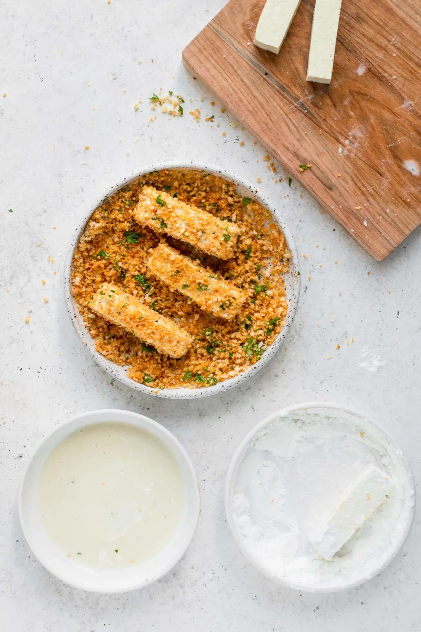 breading tofu in seasoned bread crumbs